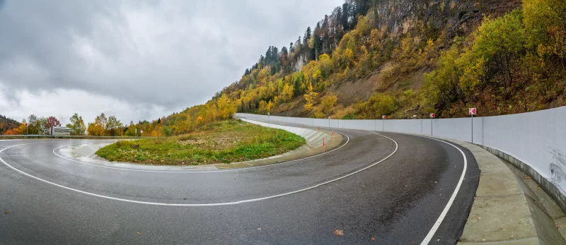Winding autumn road in Adygea mountains