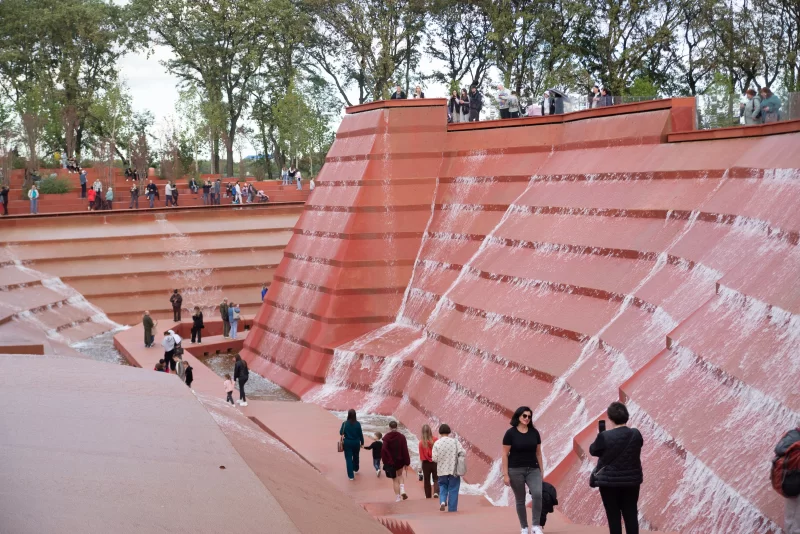 Modern waterfall and people