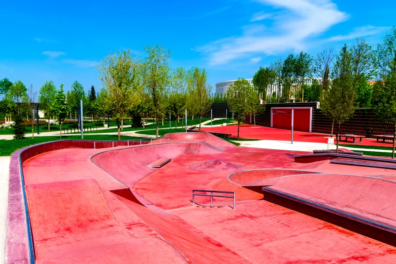 Vibrant Red Skatepark Under Clear Blue Sky