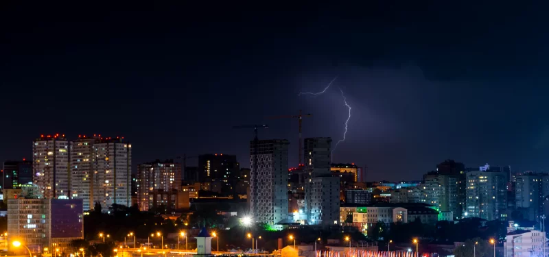 Thunderstorm over Cityscape at Night