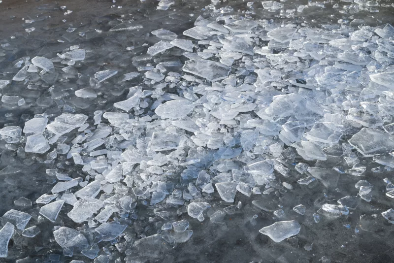 Broken ice on the surface of a frozen water body