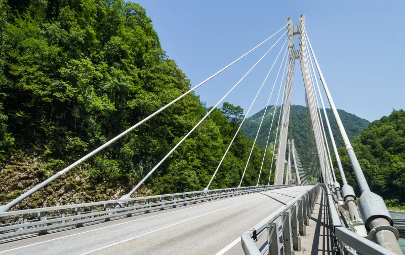 Suspension Bridge Over Mountain River