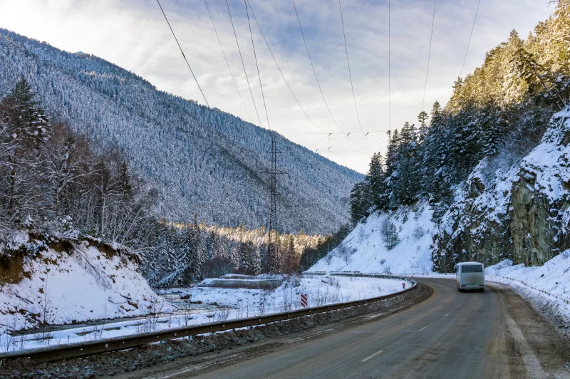 Winter mountain road with bus