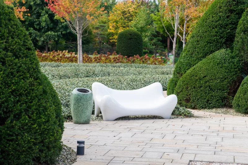 Modern Sculptural Bench in Autumn Garden