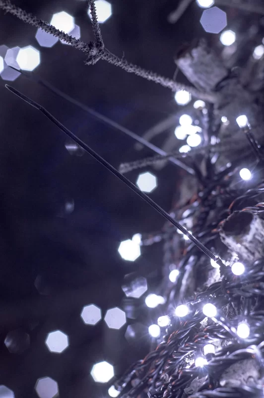 Violet garland lights on a Christmas tree
