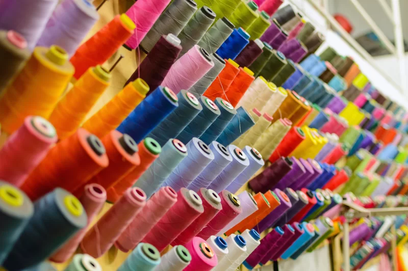 Vibrant spools of thread in a sewing workshop