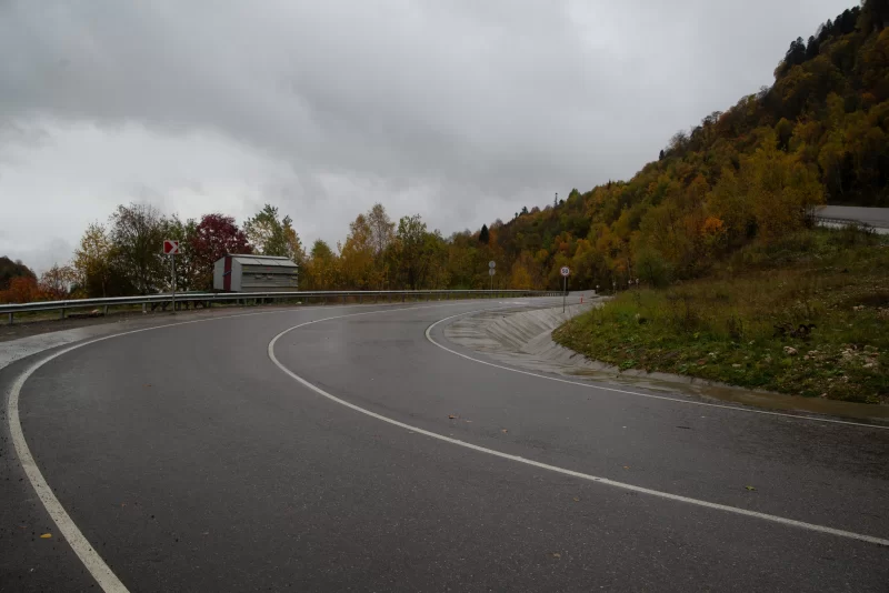 Winding autumn road in Adygea mountains