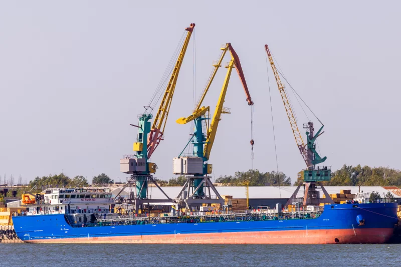 Industrial Port Scene with Cargo Ship and Cranes