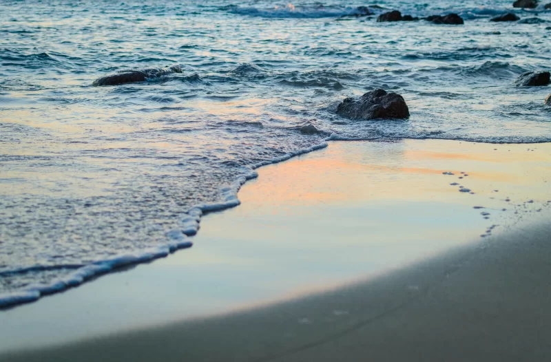Gentle Ocean Waves on Sandy Beach at Dusk