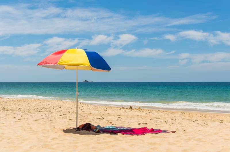 Colorful Beach Umbrella on Sandy Shore