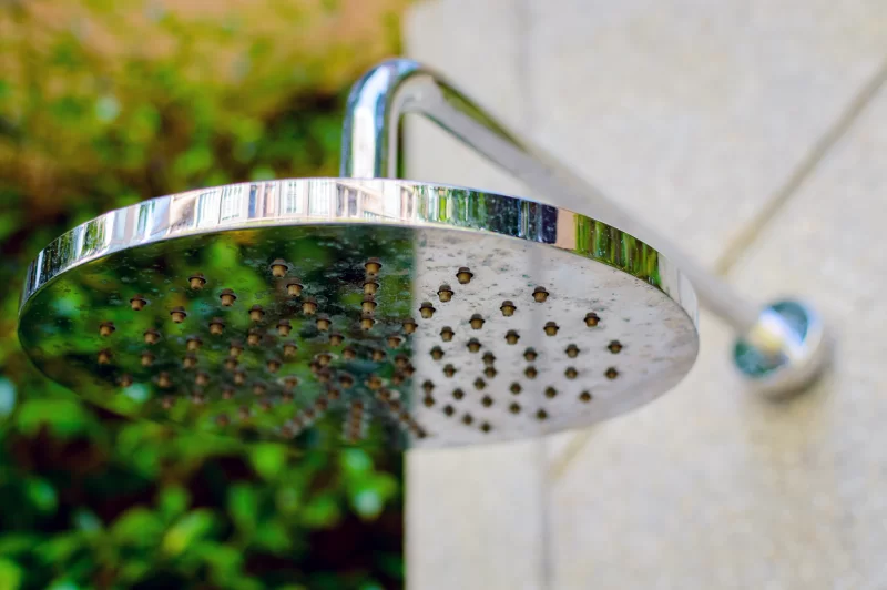 Round Shower Head with Green Nature Background