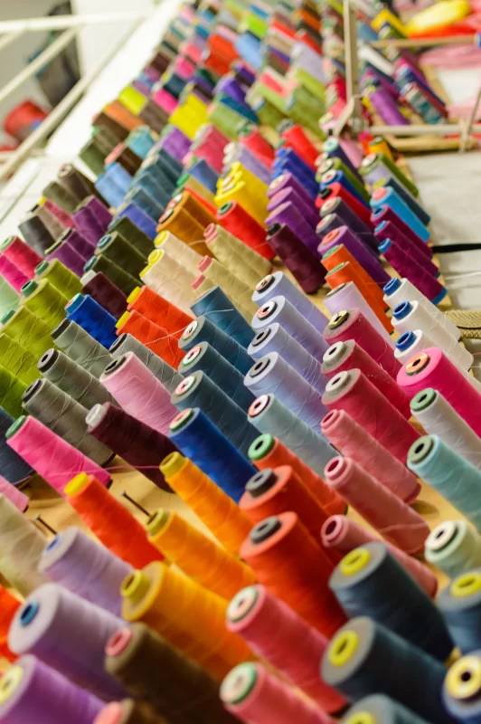 Vibrant spools of thread in a sewing workshop