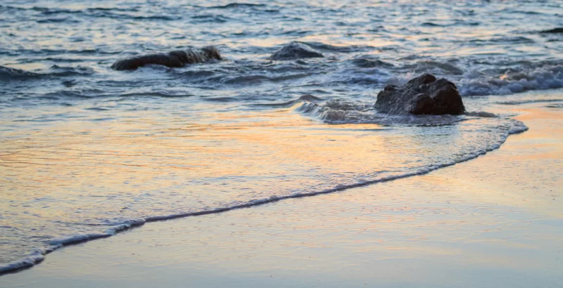 Sunset Waves on Sandy Beach