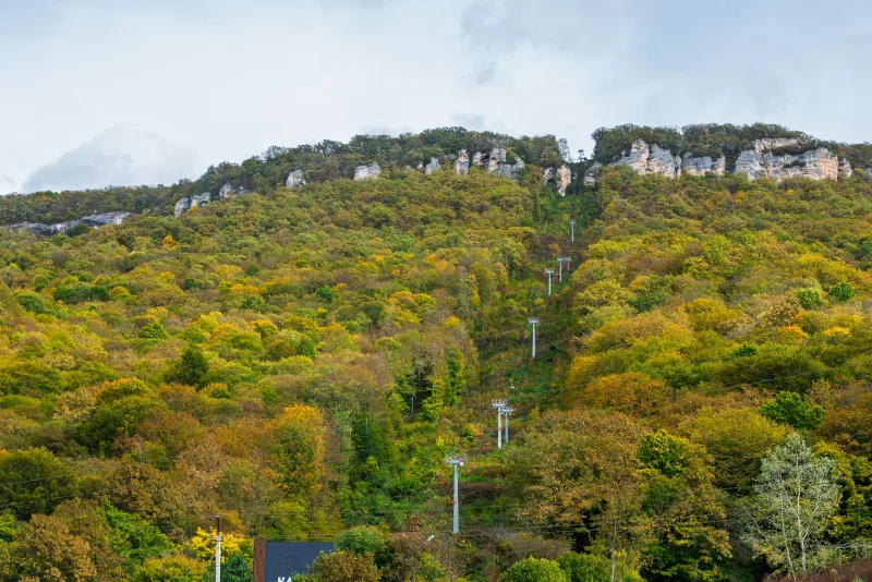 Mountain slope with ski lift in autumn