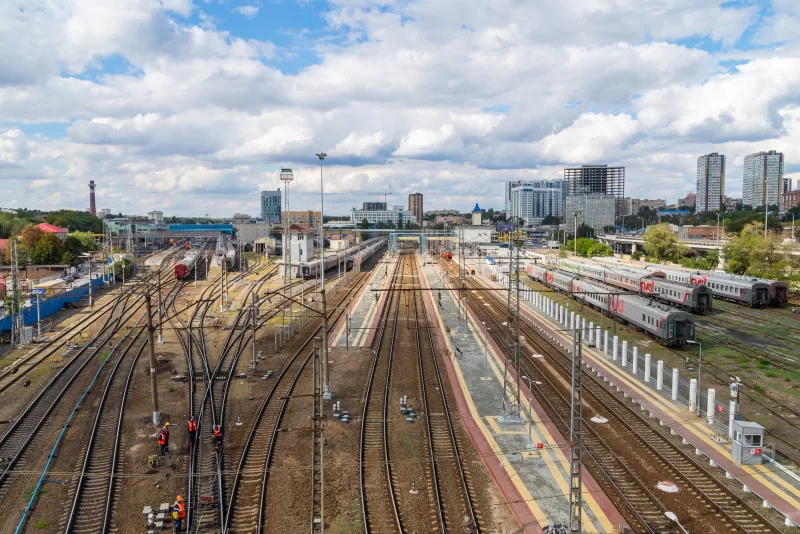 Numerous trains on sprawling railway tracks of a busy city station