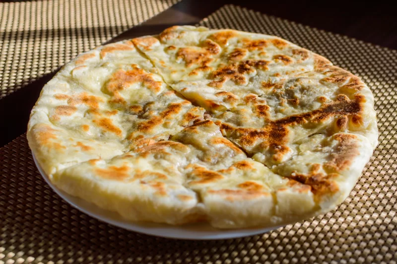Khachapuri on a plate, top view
