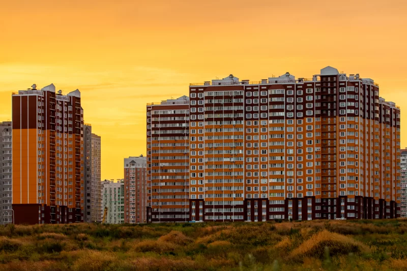 Modern high-rise apartment buildings at sunset