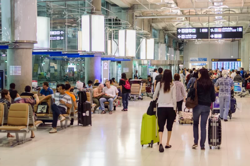 Busy Airport Terminal With Travelers