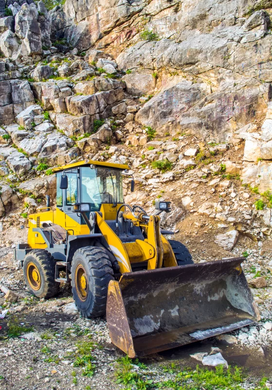 Yellow Front End Loader in Rocky Quarry