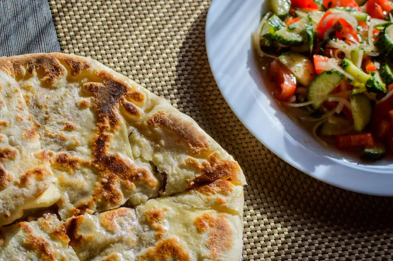 Freshly baked bread and vegetable salad