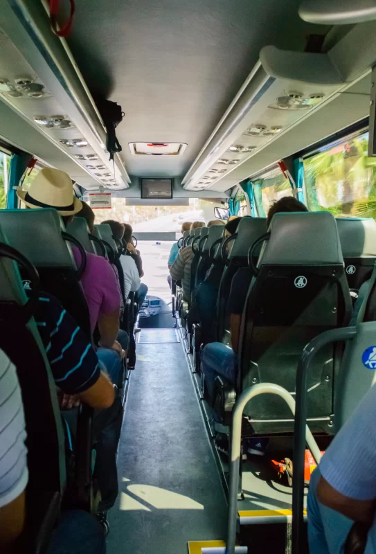 Travel by bus: people on a sunny journey through the tropics