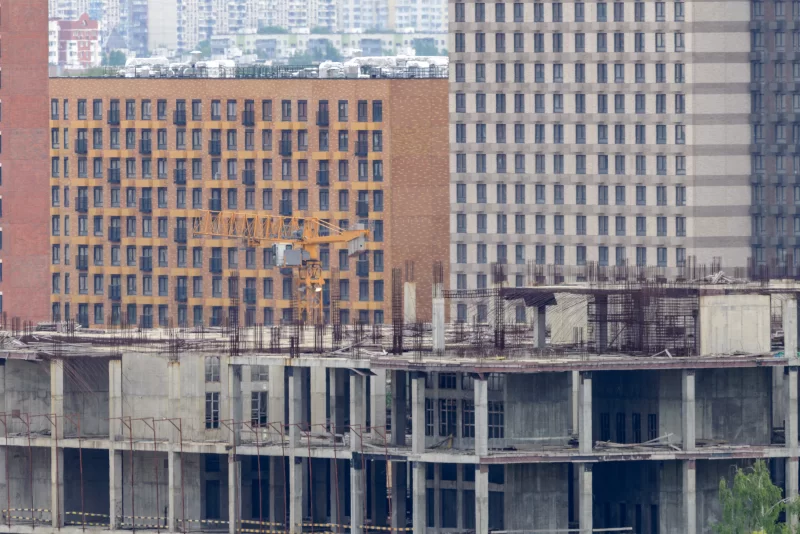 Urban Construction Site with Crane and Modern Buildings